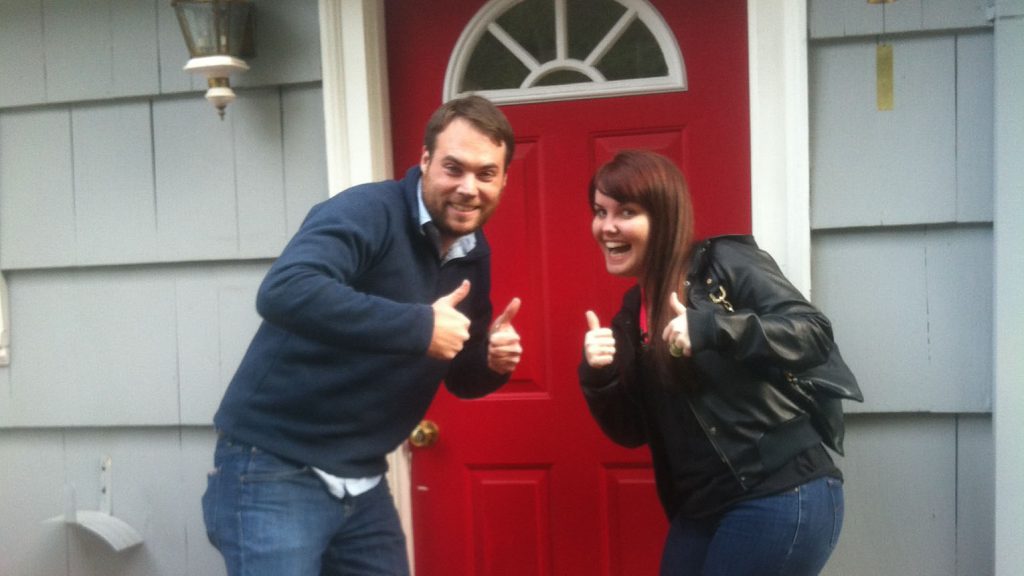 In front of our new house - 30 seconds before I proposed.